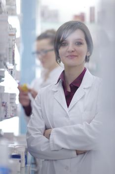 team of  pharmacist chemist woman group  standing in pharmacy drugstore