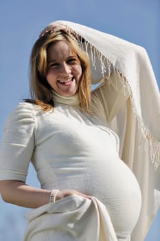 happy young pregnant womant have fun outdoor in nature at sunny day