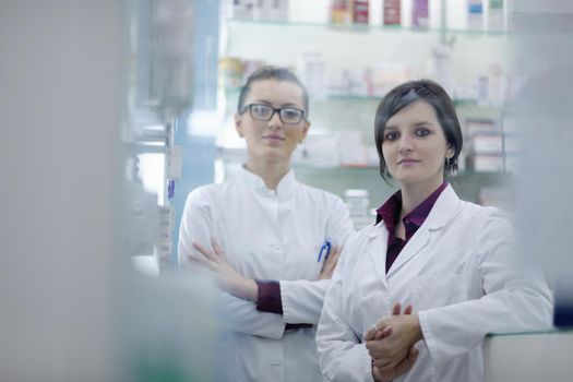 team of  pharmacist chemist woman group  standing in pharmacy drugstore