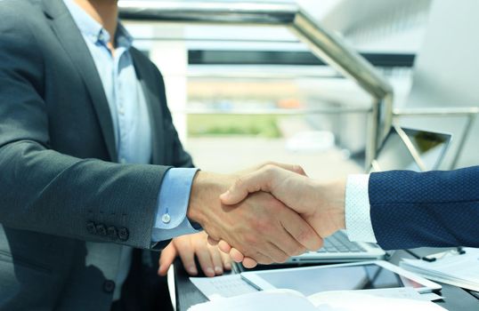 Business people shaking hands, finishing up a meeting