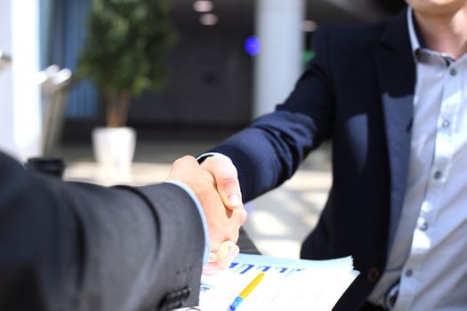 Business people shaking hands, finishing up a meeting