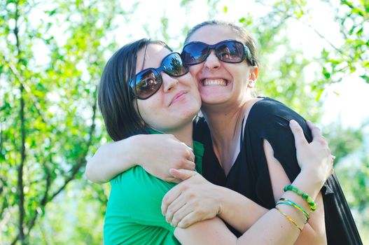 woman pragnant outdoor with friend smile and joy