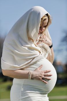 happy young pregnant womant have fun outdoor in nature at sunny day