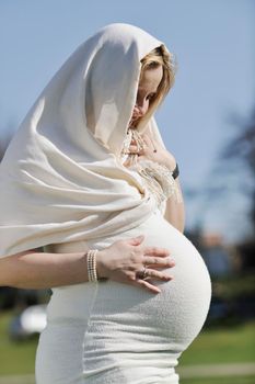 happy young pregnant womant have fun outdoor in nature at sunny day