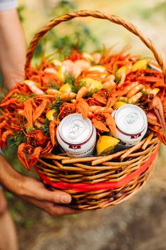 Festive woven gift basket for a man with crayfish and lemons