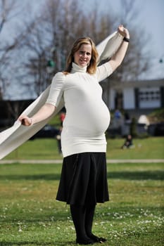 happy young pregnant womant have fun outdoor in nature at sunny day