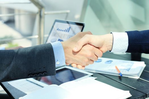 Business people shaking hands, finishing up a meeting