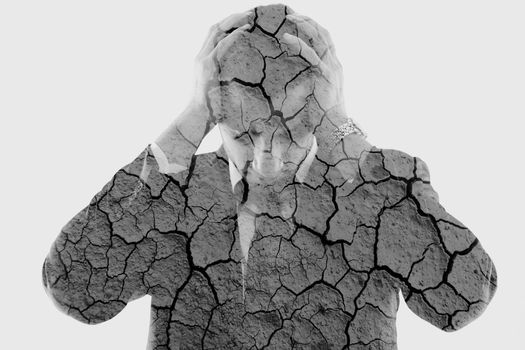 double exposure of depressed business man and dry ground background