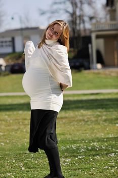 happy young pregnant womant have fun outdoor in nature at sunny day