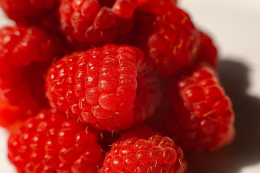 Beautiful raspberries isolated on a white background. Cut out, close up. Background and picture for postcard.