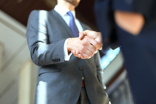 Business people shaking hands, finishing up a meeting