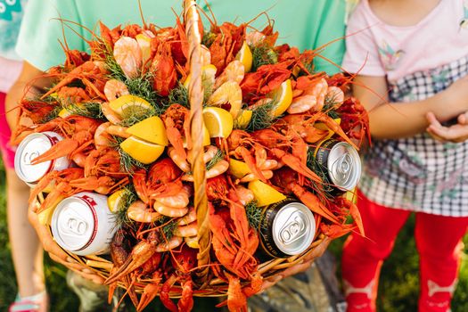 Top view of original edible bouquet with crayfish, dill, lemon, beer for unusual male gift