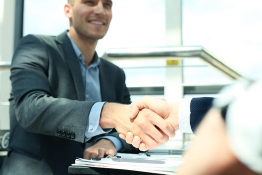 Business people shaking hands, finishing up a meeting