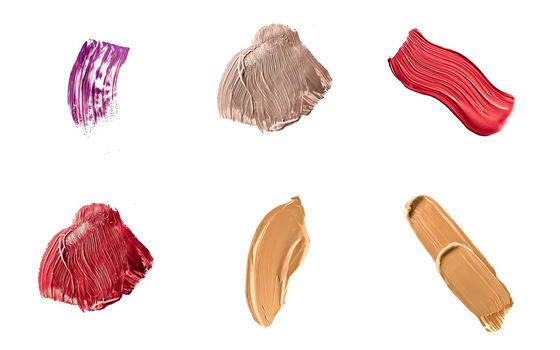 Set of art brush strokes or cosmetic makeup samples isolated on white background.