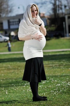 happy young pregnant womant have fun outdoor in nature at sunny day