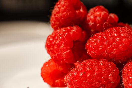 Beautiful raspberries isolated on a white background. Cut out, close up. Background and picture for postcard.