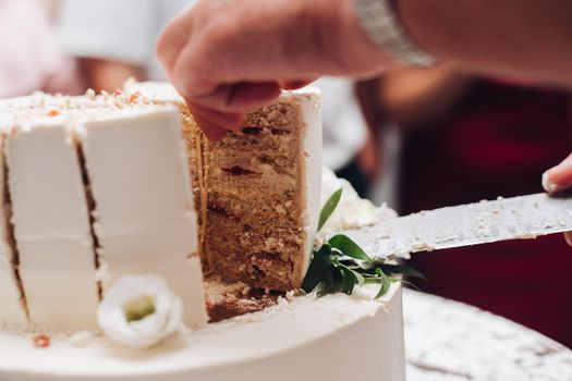 a piece of a yummy wedding cake on a plate