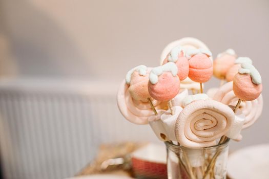 Festive sweets vanilla marshmallows and lollipops on sticks, party catering, ad photo for confectionery. High quality photo