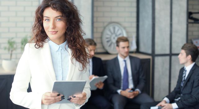 Face of beautiful woman on the background of business people.