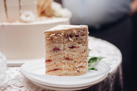 picture of a piece of a yummy white wedding cake on a plate