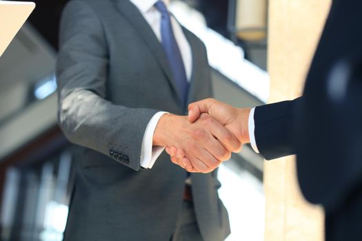 Business people shaking hands, finishing up a meeting