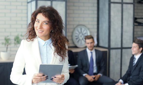 Face of beautiful woman on the background of business people.