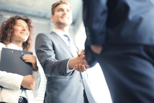 Business people shaking hands, finishing up a meeting