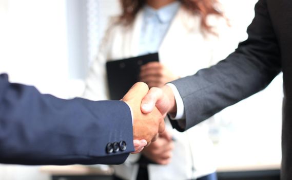 Business people shaking hands, finishing up a meeting