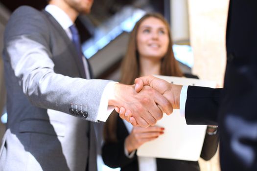 Business people shaking hands, finishing up a meeting