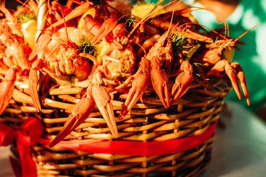 Festive woven gift basket for a man with crayfish and lemons