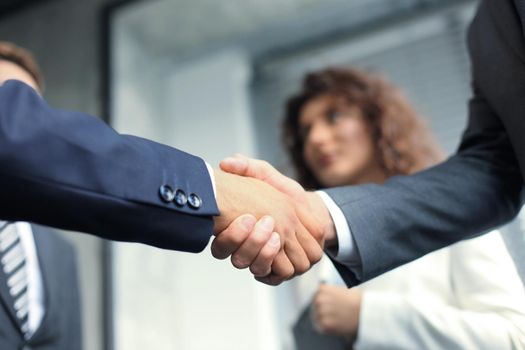 Business people shaking hands, finishing up a meeting