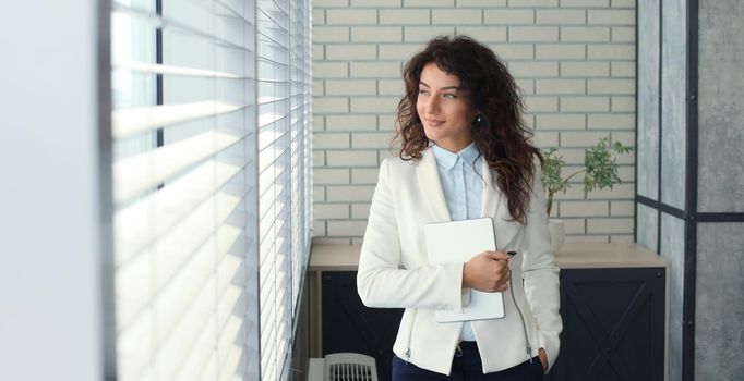 Modern business woman in the office with copy space