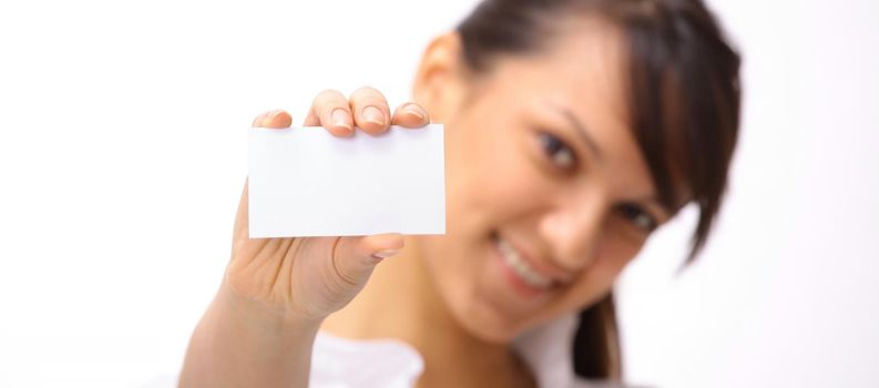 closeup.young business woman showing blank business card .photo with copy space