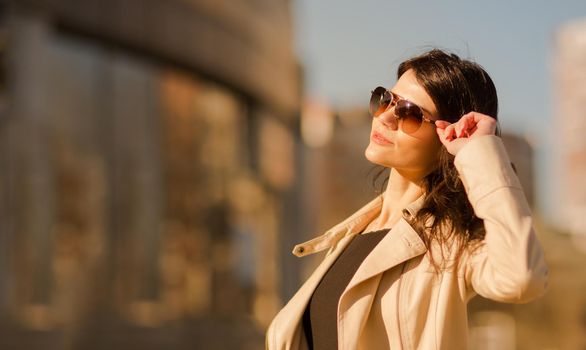 confident business woman on the background of the big city.the photo has a empty space for your text