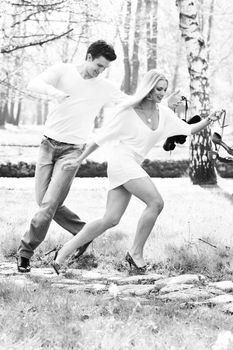 happy young romantic couple in love dance outdoor at spring season on early mornig with beautiful light