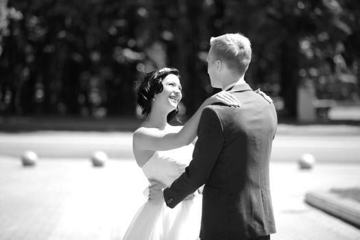 black and white photo.portrait of happy couple in wedding day on the background of a Park