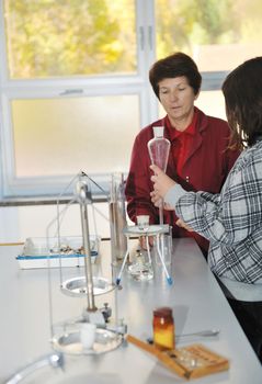 science and chemistry classees at school with smart children and teacher 