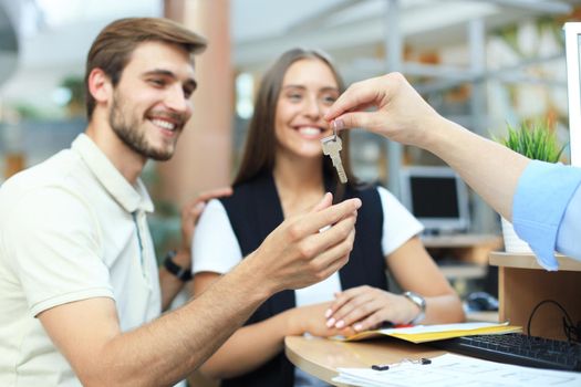 Successful lawyer giving consultation to family couple about buying house.