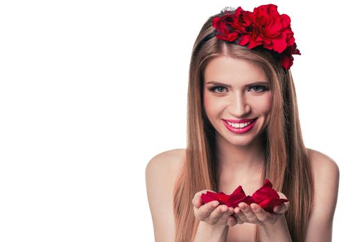beautiful blonde woman with rose petals in her hands. isolated on white background