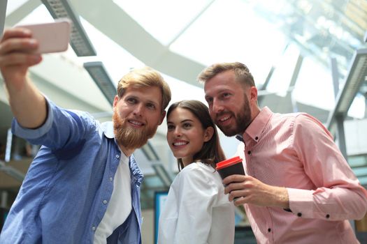 Group shot of colleagues having fun in their office