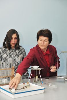 science and chemistry classees at school with smart children and teacher 