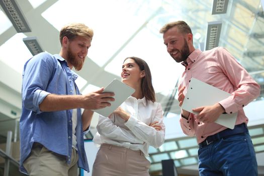 Picture of young designers using tablet in office