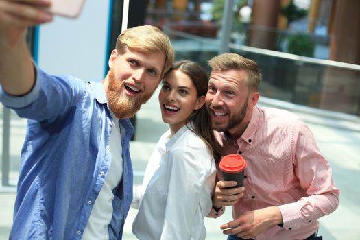Group shot of colleagues having fun in their office