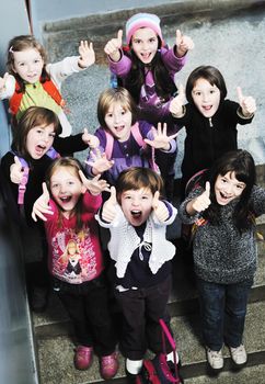 happy school girls running outdoor at sunny autumn day