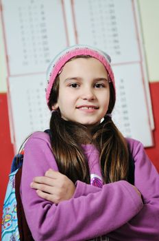 happy school girl on math classes finding solution and solving problemshappy young school girl portrait on math class