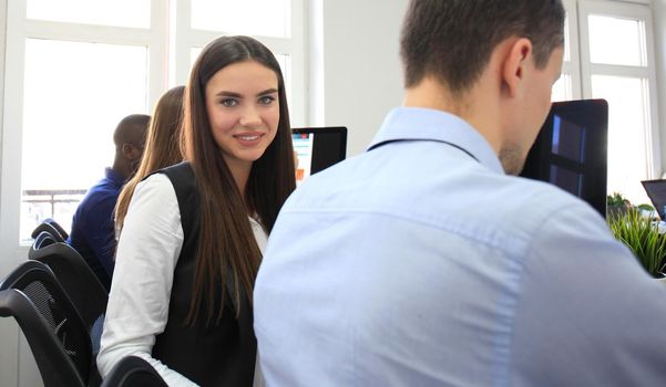 business woman with her staff, people group in background at modern bright office indoors
