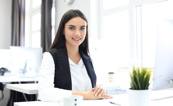 Modern business woman in the office with copy space