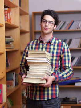 happy young teen boy in school on chemistry classes and library