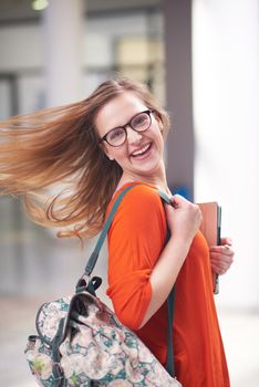 happy student girl working on tablet computer at modern school university indoors