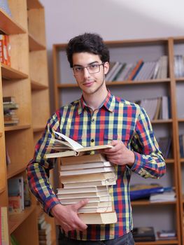 happy young teen boy in school on chemistry classes and library